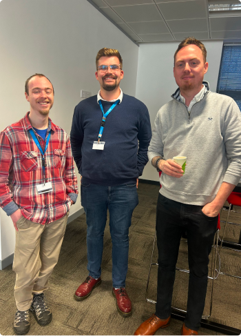 Three members of Infotel UK Consulting staff